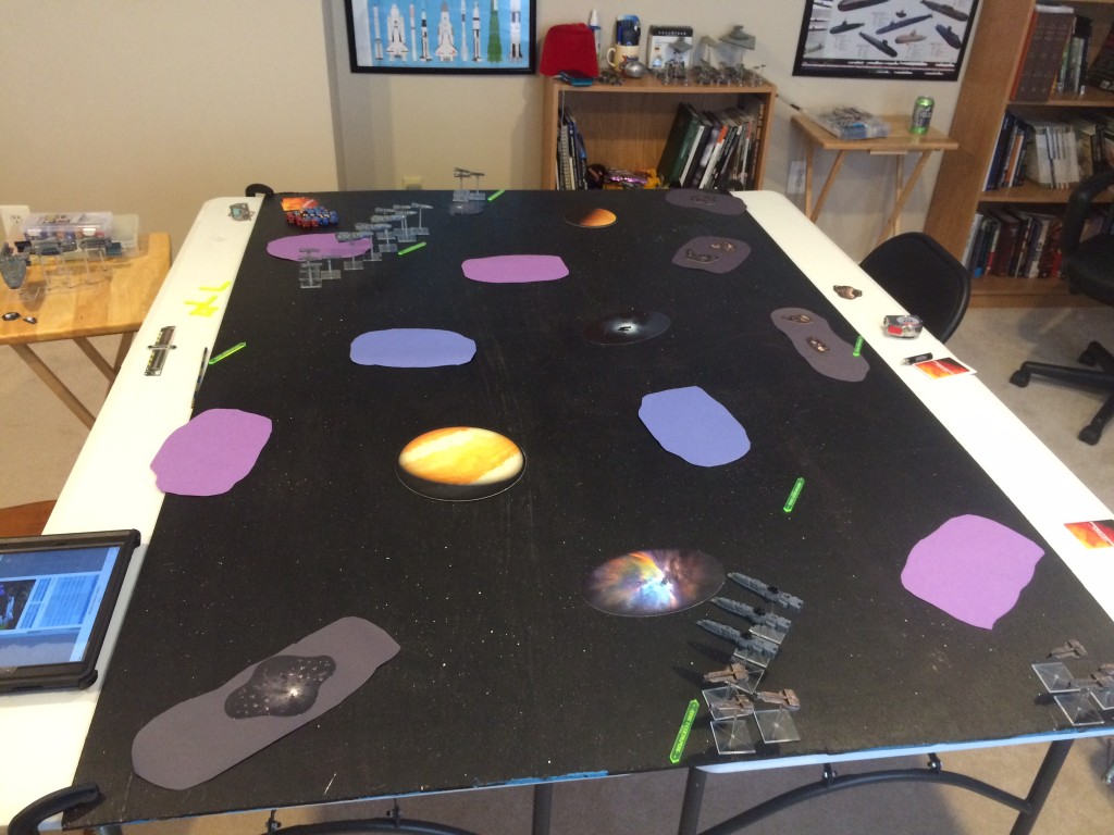 Here is the table after deployment. We are using construction paper as hastily made stand-ins for area terrain. Purple=Gas Clouds, Blue=Debris Fields, and Grey=Asteroid Fields.